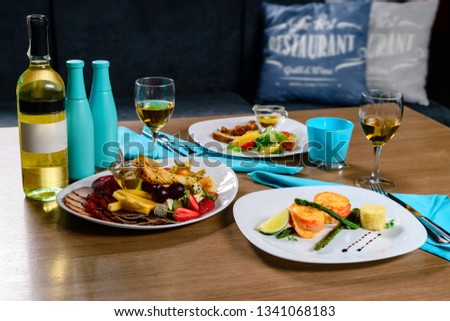 romantic dinner and wine in a restaurant, copy space place for text, design layout