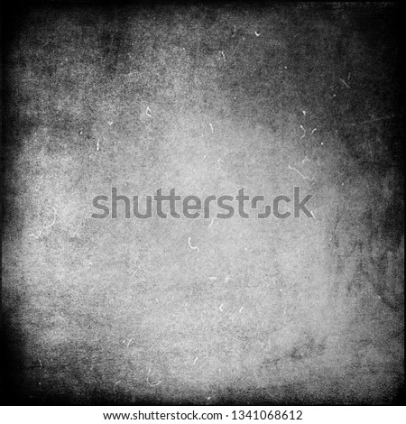 Grunge grey obsolete texture with black frame, scary scratched background, old film effect
