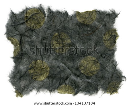 Texture of dark gray rice paper with yellow polka dots embedded, with torn edges. Isolated on white background.