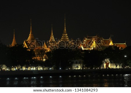 Ancient or old Thai architecture art temple is Wat-phra-keaw or Phra-keaw temple me take a photo in the night opposite the chao-phra-ya river.