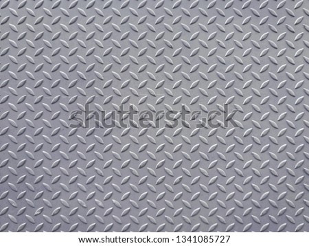 Steel checker plate metal sheet; Metal sheet seamless texture background.