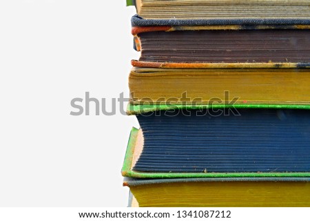 Pile of hardcover vintage books isolated with copy space. White background. Close-up.