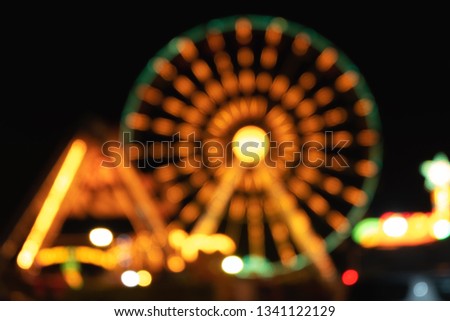 Amusement park bokeh, Blurred Photo, cityscape at night time.