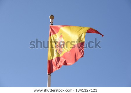 the spanish flag in the wind at spanish sky, spain