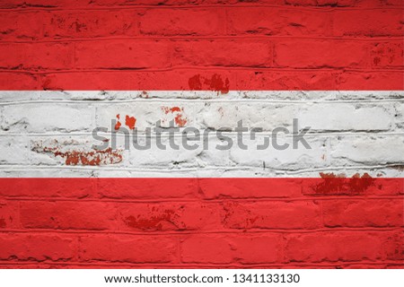 Austria flag on brick wall background. Wallpaper for installation and design. Space for text.