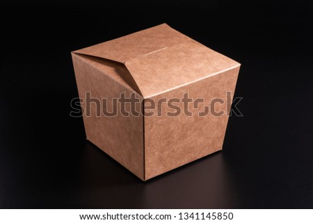 Kraft cardboard box on a black background, moke up