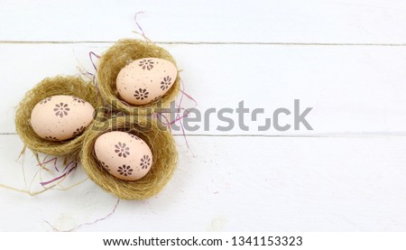 Easter eggs in baskets isolated