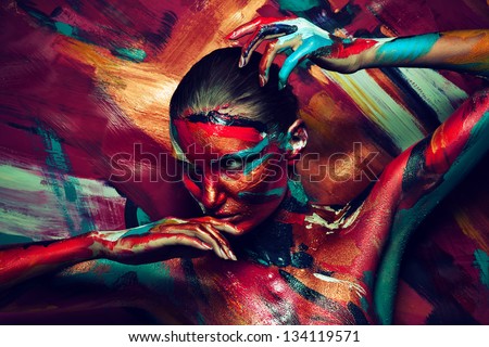 young girl in colourful paint