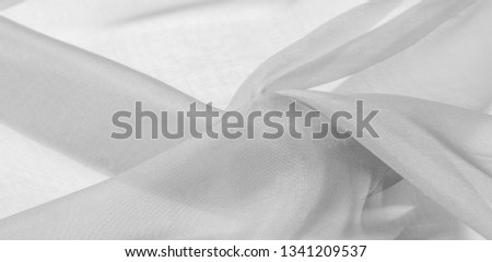 White silk fabric texture pattern. It is also perfect for your design, clothes, posters. Be creative with beautiful project accents. This fabric is inspired by your inspiration.