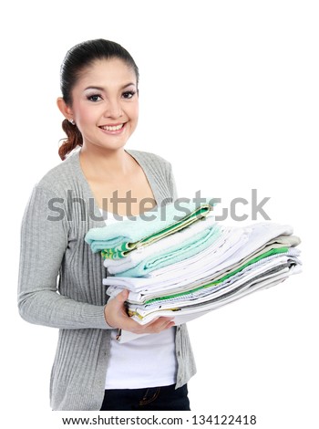woman doing a housework holding laundry isolated over white background