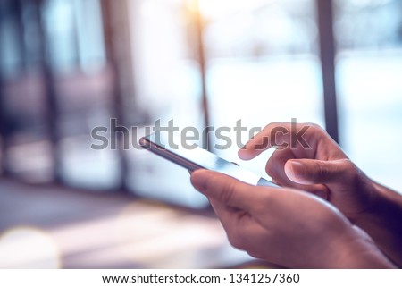 Close up of woman hands using mobile smartphone at home, She searching or social networks concept. copy space.
