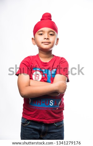 Portrait of Indian Sikh/punjabi little boy with multiple expressions. isolated over white background