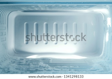 Freezer of a Refrigerator with Buildup ice. Royalty-Free Stock Photo #1341298133