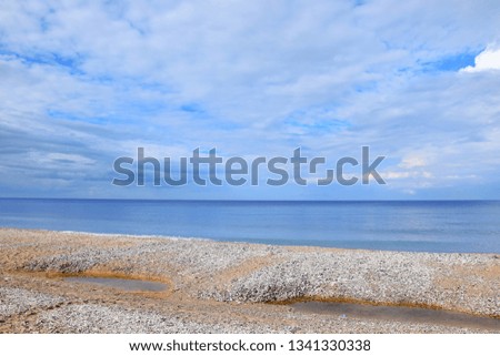 Seascape Beach Covered with Seashells Shore Colorful Scenic Landscape Background Wallpaper Stock Photo