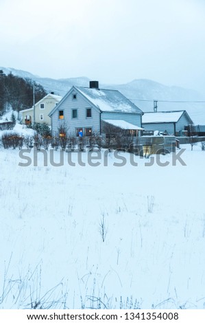 Beautiful house surrounded by snow at Christmas in Norway