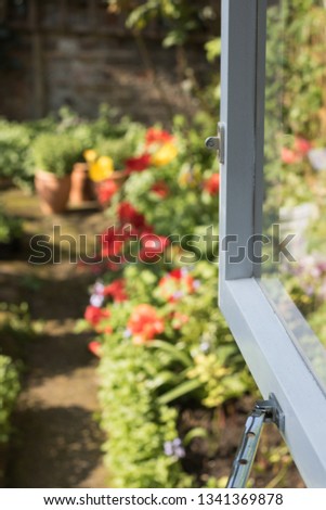 Vertical Image: Open Window to Blooming Garden Background on Sunny Day. 