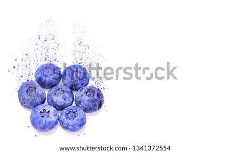 Dissolving texture of five blueberry group in the corner of white background