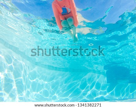 child in pool 