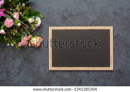 Festive flower composition on black background. Copy space