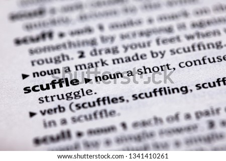 Blurred close up to the partial dictionary definition of Scuffle