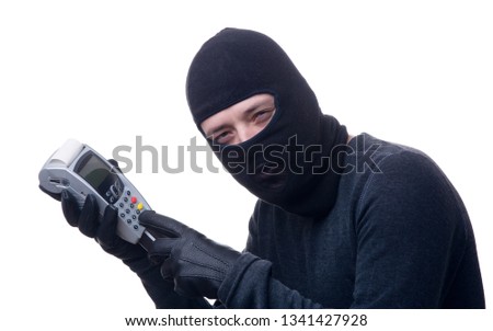 Image of thief in black mask with terminal in hands.