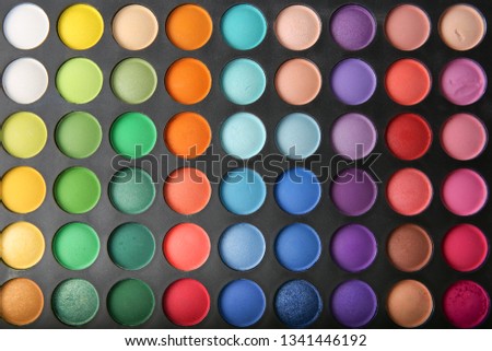 background from eye shadow palette. different colors of makeup powder. blank for business cards or a web site of make-up artist.