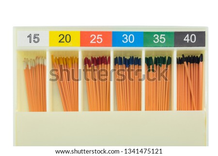 gutta-percha pins in a set of different sizes for root canal filling, material for endodontic filling, isolated on a white background