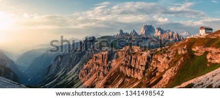 Awesome Nature Landscape. Amazing Dolomite Mountains Landscape during sunset. Incredible view of Dolomites Alps. Tre Cime di Lavaredo National park. Picture of wild area. Amazing alpine valley