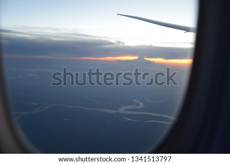 River and sky view from airplane window