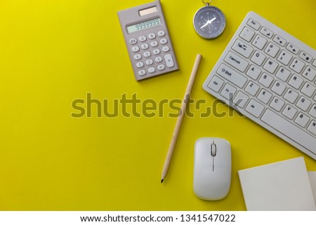 Business objects on yellow background, Business direction concept.