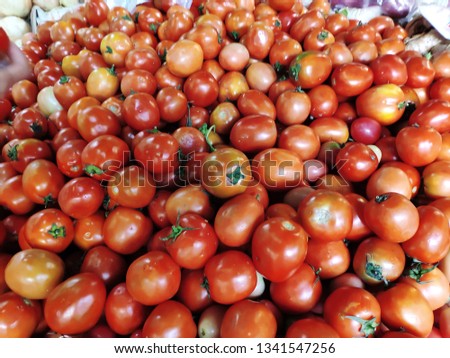 Fresh tomatoes are sold in the market.