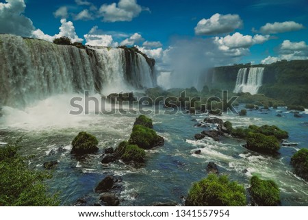 The biggest waterfall in Brazil and Argentina. Foz do Iquasu. Puerto Iguazú . Big water. Tropical forest. Little boat in river