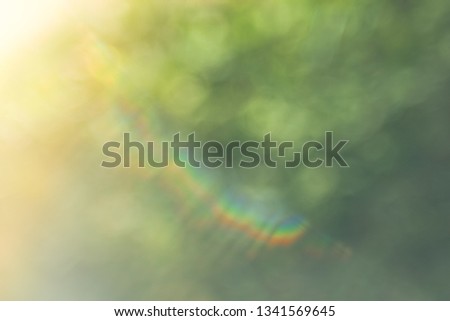 Defocused abstract nature background with green leaves and bokeh lights. Royalty high-quality free stock image of natural blurred bokeh background from leaf and tree