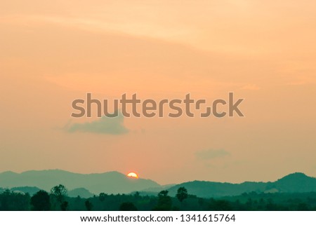 Sunset sky over silhouette mountain in the evening 