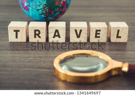 Navigation Explore of Journey Planning., Travel Destination and Expedition Plan Vacation trip., Close Up of Layout Magnifying Glass, Global Model, Wooden Cube With Word Text on a Table. Travel Concept