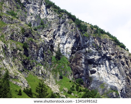 Waterfall Sidensackfall or Wasserfall Sidensackfall, Spritzbach stream in the Alpine Valley of Maderanertal - Canton of Uri, Switzerland