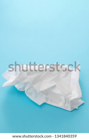 white tissue paper on blue background