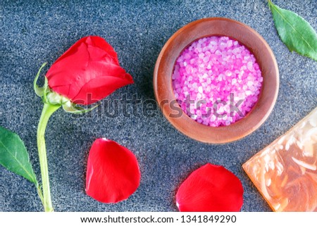 Spa still life with roses, sea salt, soap on ceramic tile. Relax time concept Top view