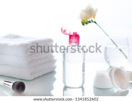 Cleansing face or make up remover cosmetic bottle in the bathroom concept close up Royalty-Free Stock Photo #1341852602