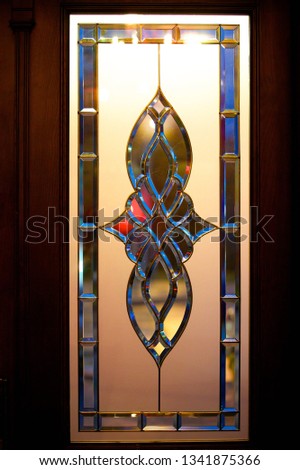 Stained glass window or door. Pattern of matte and glossy glass.