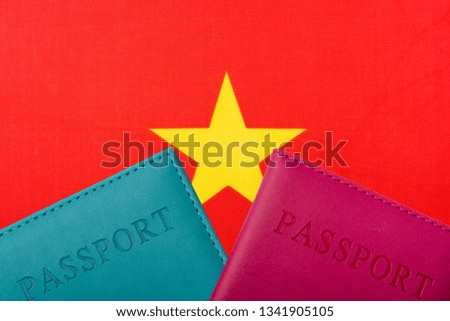 On the background of the Flag of Vietnam are passport. Travel and tourism concept.