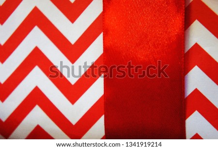 wrapped gift box background with stripes. red zigzag packaging for the holiday.