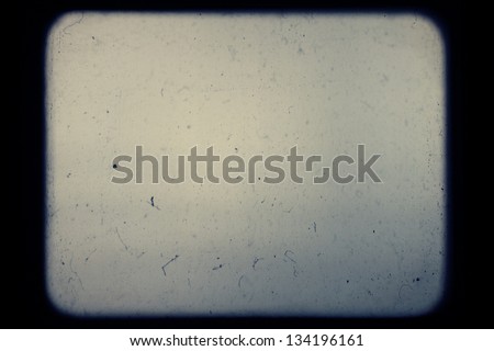 Real slide projector screen with optical effects and dust. Royalty-Free Stock Photo #134196161