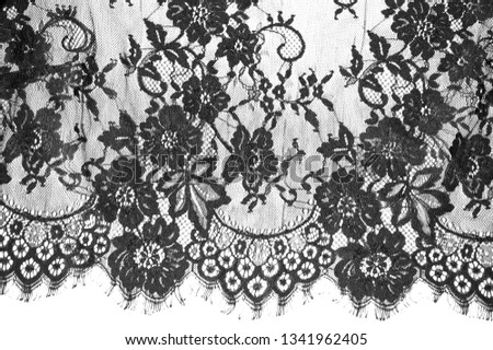 exture background, pattern. black lace fabric. This beautiful lace fabric is perfect for your design, overlays, accents and wallpapers. It has a jagged border along both edges adorned with filaments