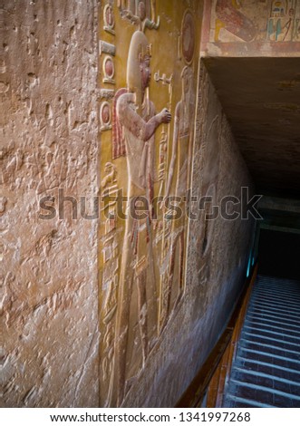 Old Egyptian tomb entrance. Carved image of a Horus and Ramses pharaoh. Valley of the kings - Luxor Egypt. 