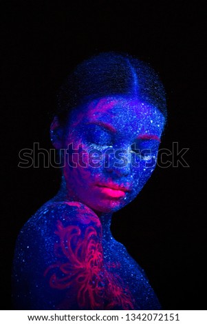 Picture of a pink jellyfish on the shoulder and face. Blue girl alien  sleeps. Tilted her head to the shoulder