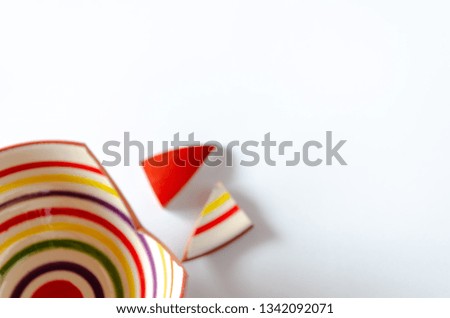 Blur of Fallen Bowl and broken pieces on white background