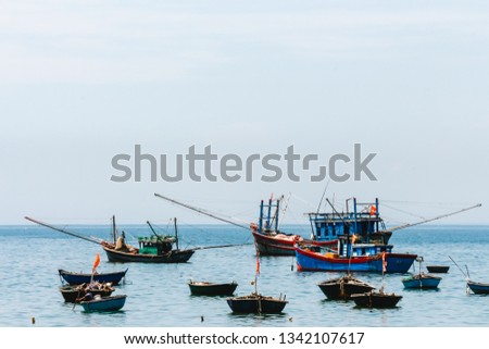 Many Vietnamese fishing boats in the field. Authentic Vietnamese blue boats.