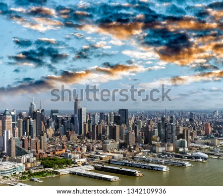 Amazing aerial view of New York City. Midtown Manhattan skyline from helicopter on a sunny afternoon.