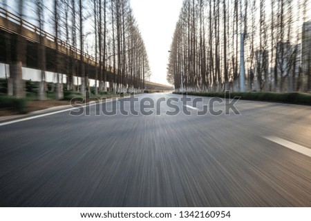 high speed view of asphalt road in city